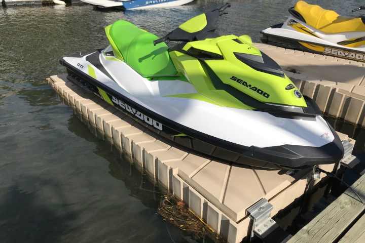 a row of parked motorcycles sitting on top of a boat