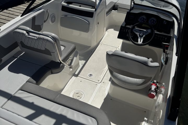 Top view of a white boat interior at a dock.